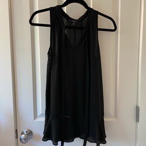 Black wide tank top, with a semi ruffled bottom w/ cut out detailing